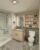 A bathroom with a walk-in shower